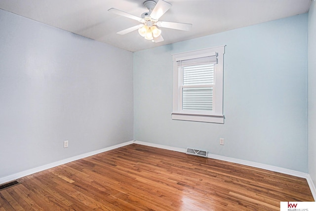 spare room featuring ceiling fan and hardwood / wood-style floors