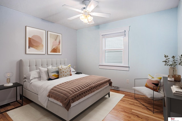 bedroom featuring ceiling fan and light hardwood / wood-style flooring