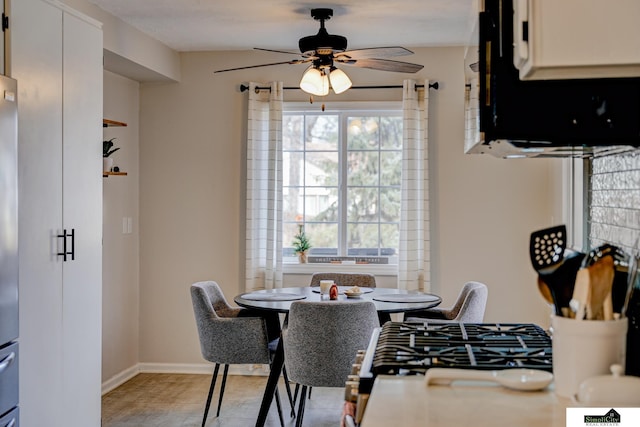 dining room with ceiling fan and a healthy amount of sunlight