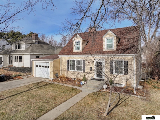 cape cod home featuring a garage and a front yard