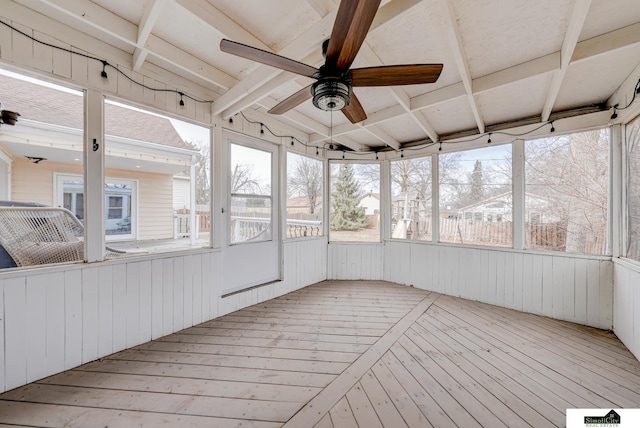 unfurnished sunroom with ceiling fan