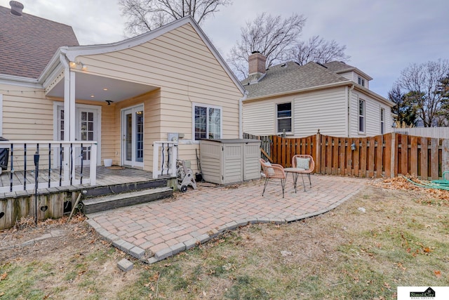 back of property featuring a patio and a deck