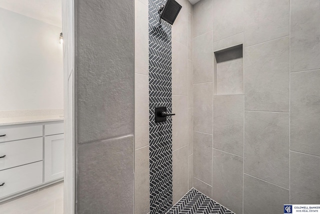 bathroom with a tile shower