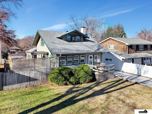 view of front of property with a front lawn and a deck