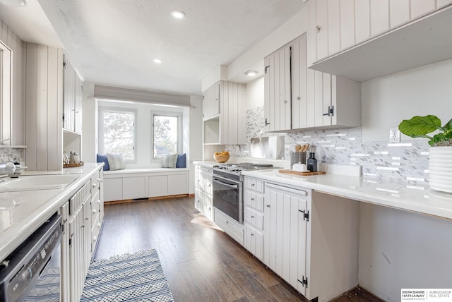 kitchen with tasteful backsplash, stainless steel range with gas stovetop, black dishwasher, and white cabinets