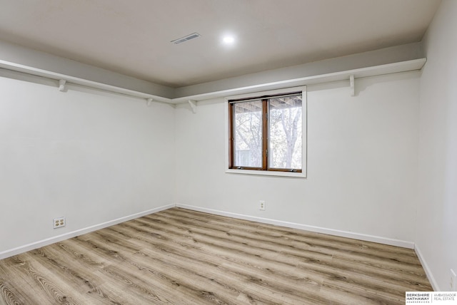 walk in closet featuring light hardwood / wood-style floors