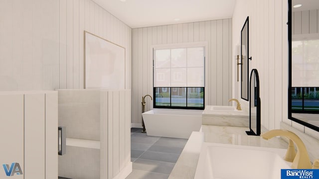 bathroom featuring tile patterned flooring, a bathing tub, sink, and wood walls