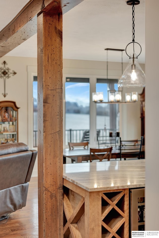 dining room with hardwood / wood-style flooring and a chandelier