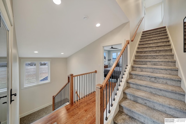 stairs featuring hardwood / wood-style flooring