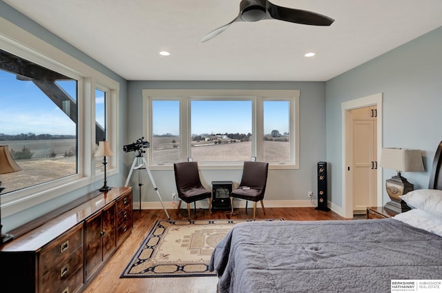 bedroom featuring ceiling fan and light wood-type flooring