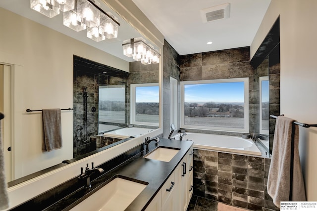 bathroom with vanity and separate shower and tub