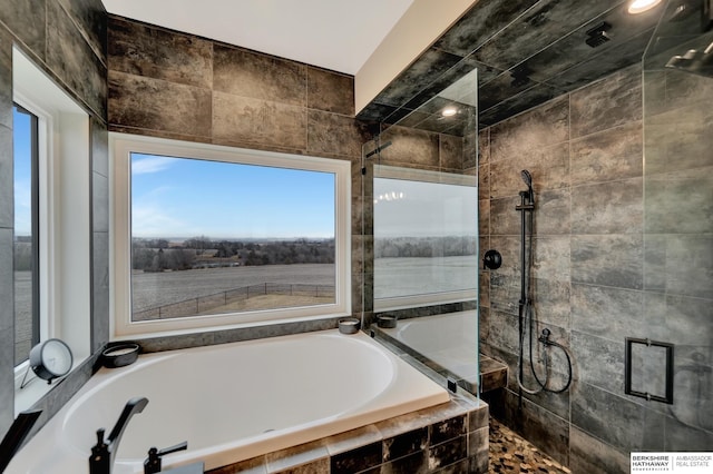 bathroom featuring plus walk in shower