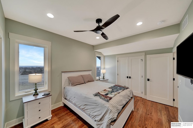 bedroom featuring hardwood / wood-style floors and ceiling fan
