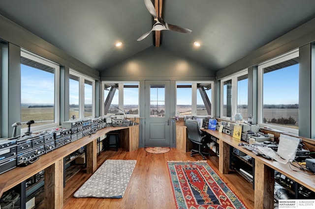 sunroom / solarium featuring vaulted ceiling with beams, a wealth of natural light, and ceiling fan