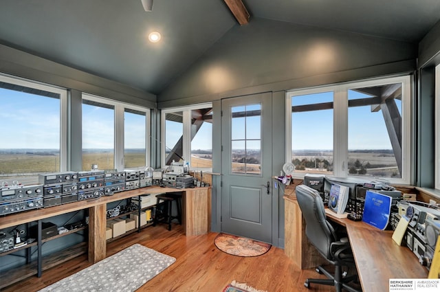 office featuring hardwood / wood-style flooring and vaulted ceiling with beams