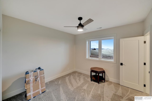 miscellaneous room featuring light carpet and ceiling fan