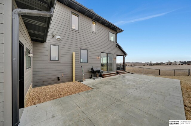 rear view of house featuring a patio