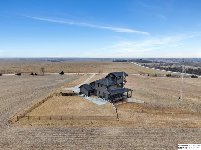 birds eye view of property with a rural view