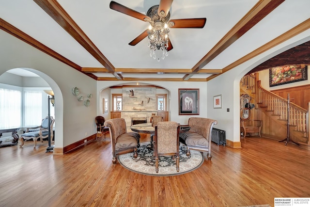 dining space with radiator, light hardwood / wood-style flooring, and a wealth of natural light