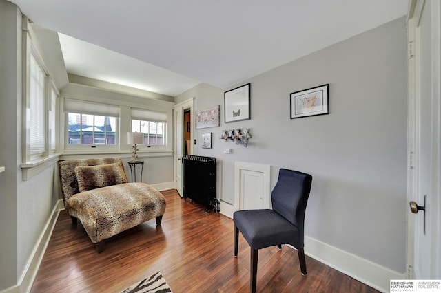 living area with hardwood / wood-style flooring