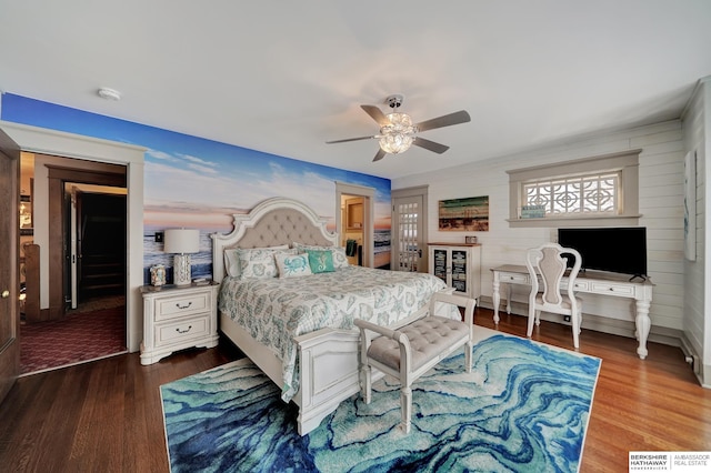 bedroom with ceiling fan and dark hardwood / wood-style flooring