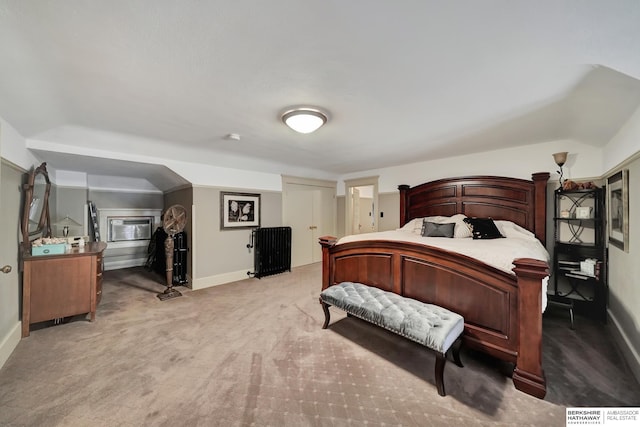 bedroom featuring light carpet and lofted ceiling