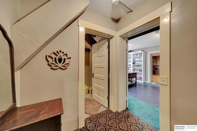 hallway with light colored carpet