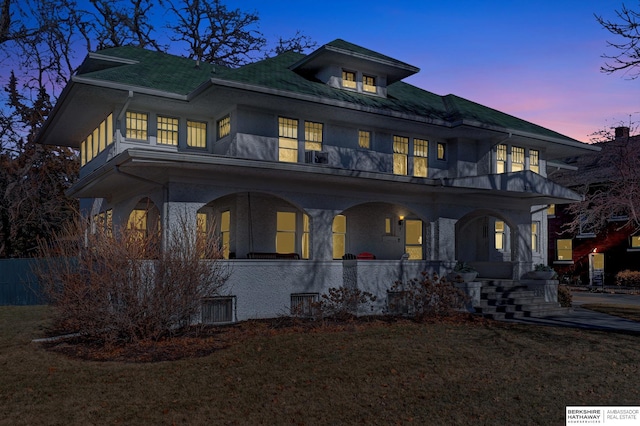 view of front of home with a yard