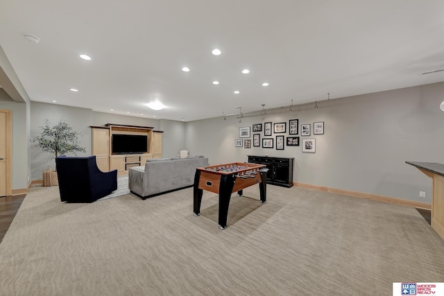 game room featuring light carpet