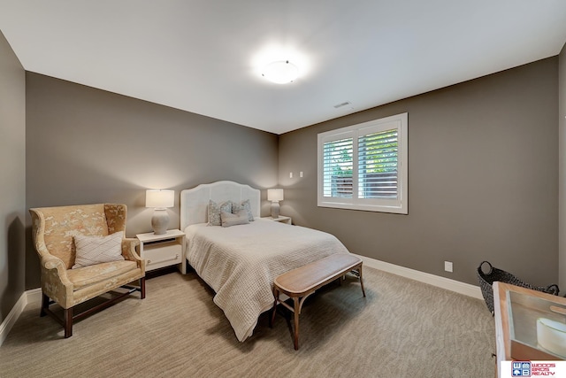 bedroom with light carpet