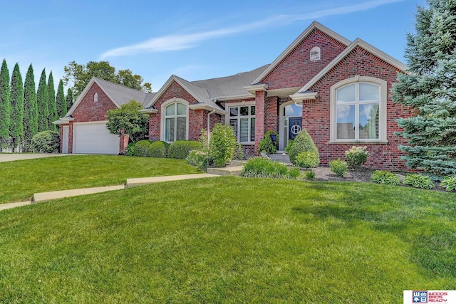 view of front facade with a garage and a front yard