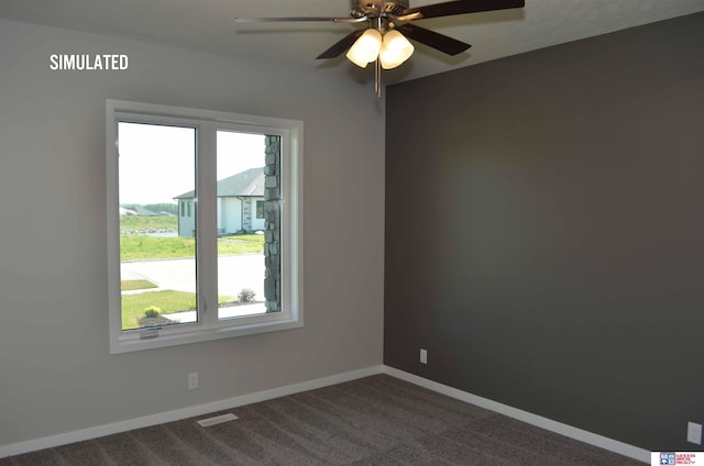 carpeted spare room featuring ceiling fan