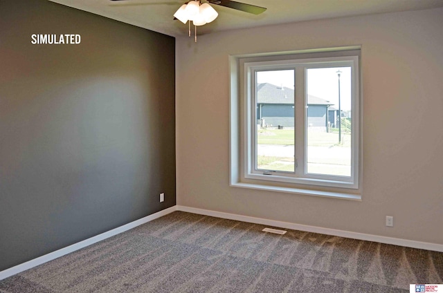 empty room with carpet and ceiling fan