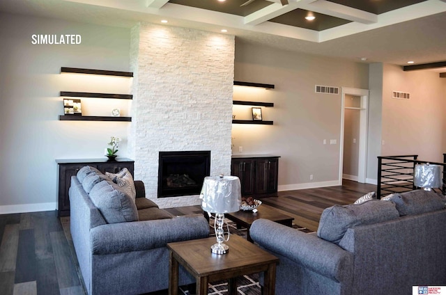 living room with coffered ceiling, a stone fireplace, dark hardwood / wood-style floors, and beam ceiling