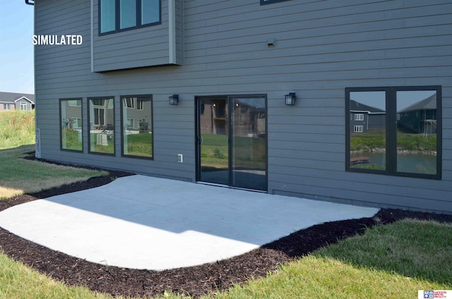 back of property featuring a patio area and a lawn