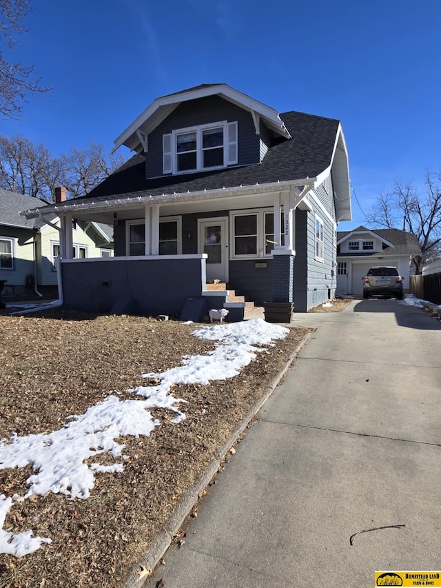 view of front of home with a garage and covered porch