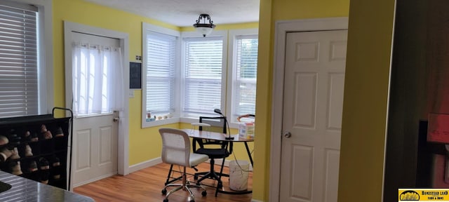 office with light hardwood / wood-style flooring