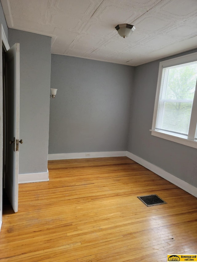 empty room featuring light hardwood / wood-style floors