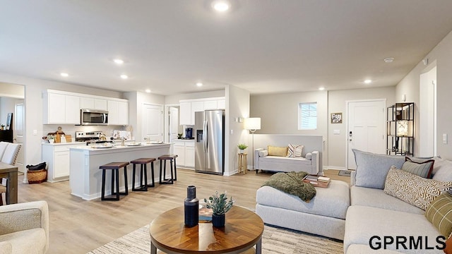 living room with light hardwood / wood-style floors