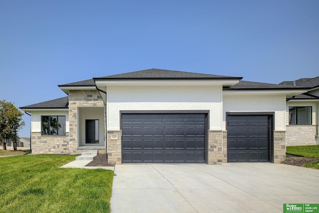 prairie-style home with a garage and a front yard