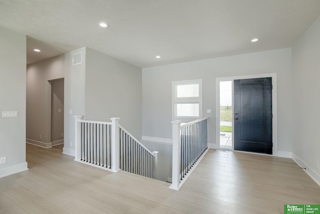 foyer entrance featuring light hardwood / wood-style floors