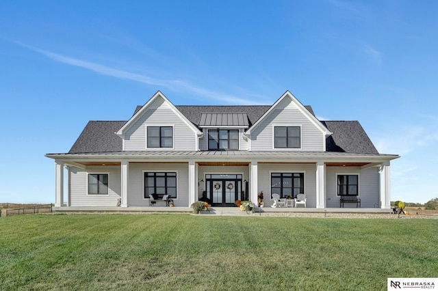 view of front of home with a front lawn and a porch