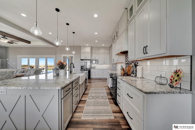 kitchen with white cabinetry, black range with electric cooktop, light stone countertops, and hanging light fixtures