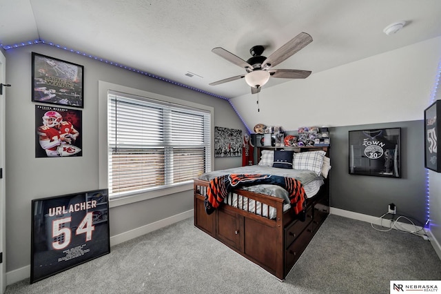 bedroom featuring lofted ceiling, carpet, and ceiling fan