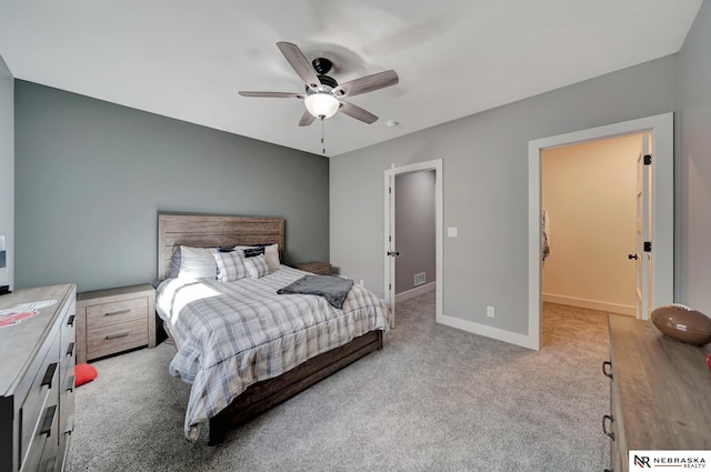 bedroom with light carpet and ceiling fan