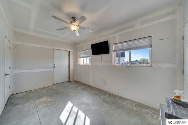 empty room with plenty of natural light and ceiling fan