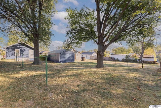 view of yard with a storage unit