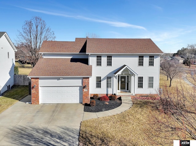 colonial inspired home featuring a garage