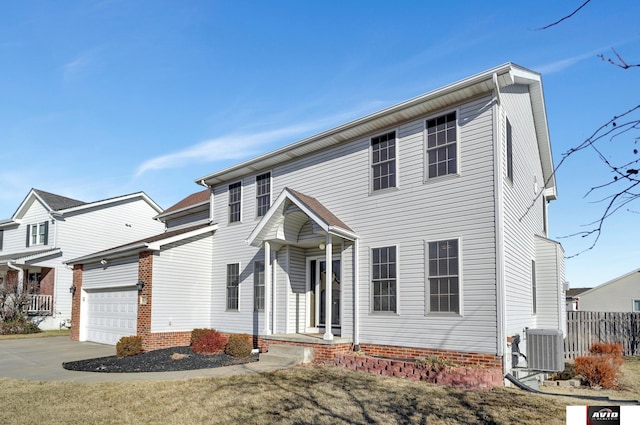 front facade with central AC unit and a garage