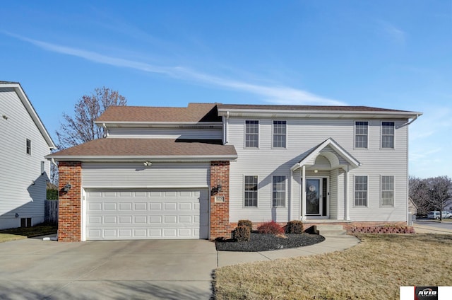 view of front of property with a garage and a front yard